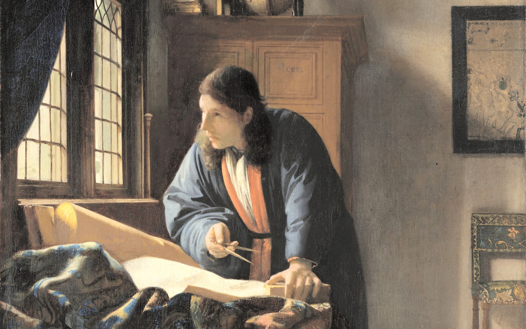 A geographer at his charts with dividers and a celestial globe, a painting by Johannes Vermeer